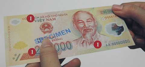 Ba vị trí kiểm tra kỹ thuật in lồi, khắc lõm trên mặt trước tờ tiền polymer.