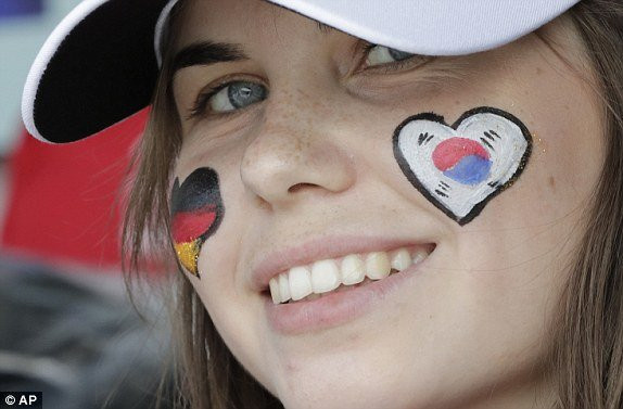 1530102849727_lc_galleryImage_A_woman_with_her_face_pai 11