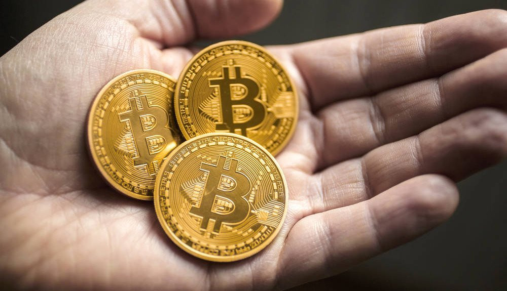 3-Bitcoins-in-hand-1000x575