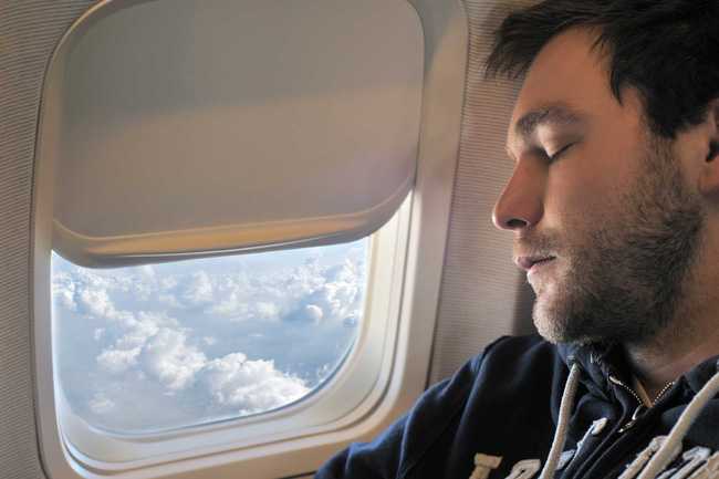 12-sleep-against-window-travel-tips-airplane-csondy-1478859104920