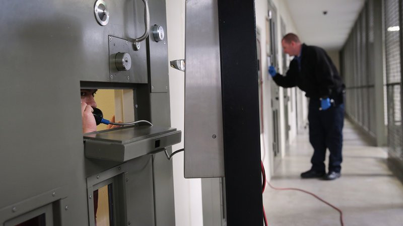 ...Here an immigrant detainee makes a call from his segregation cell at a detention facility in Adelanto Calif 3
