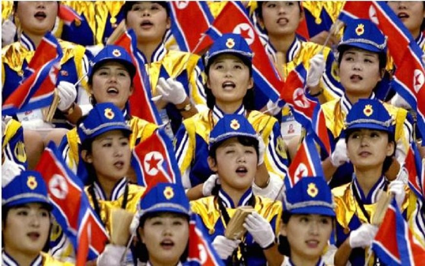 co-vu-trieu-tien-North Korean women cheer their men's basketball team during a game against the Philippines at the 14th Asian Games in Pusan, September 30 , 2002-reuters 3