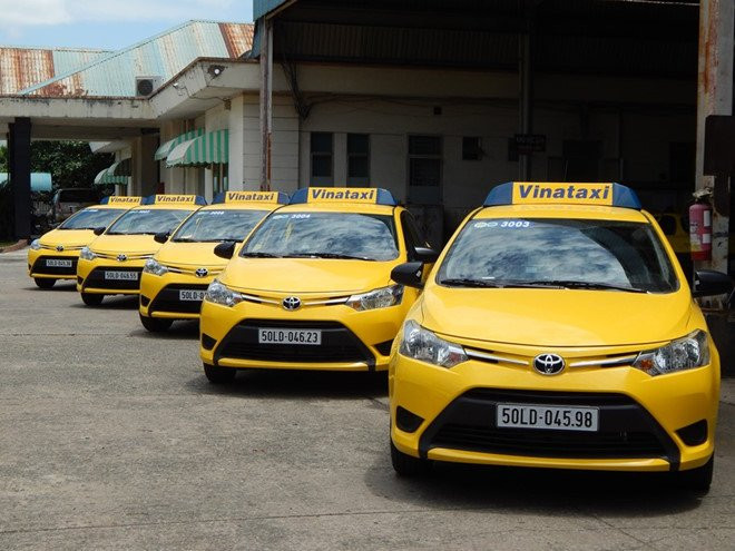 Hai hang taxi TP.HCM muon sap nhap de canh tranh Grab hinh anh 1