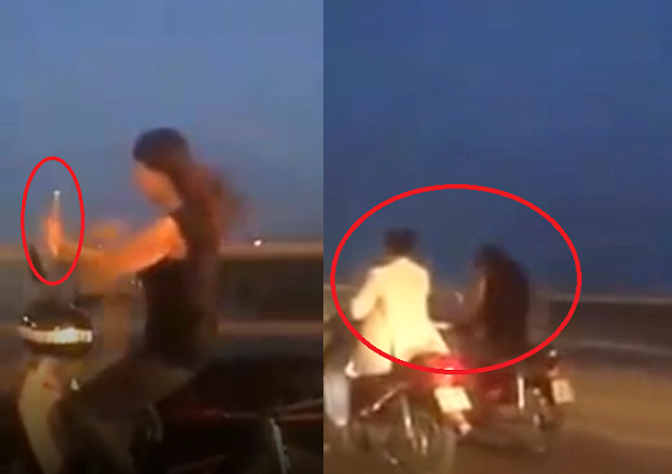 Thiếu nữ vừa lái xe máy vừa chụp ảnh 'tự sướng' trên cầu Vĩnh Tuy