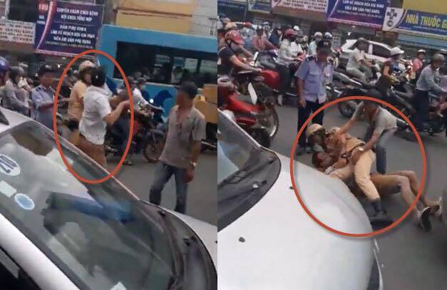 CSGT quật ngã tài xế taxi đỗ xe giữa đường, thách thức cảnh sát