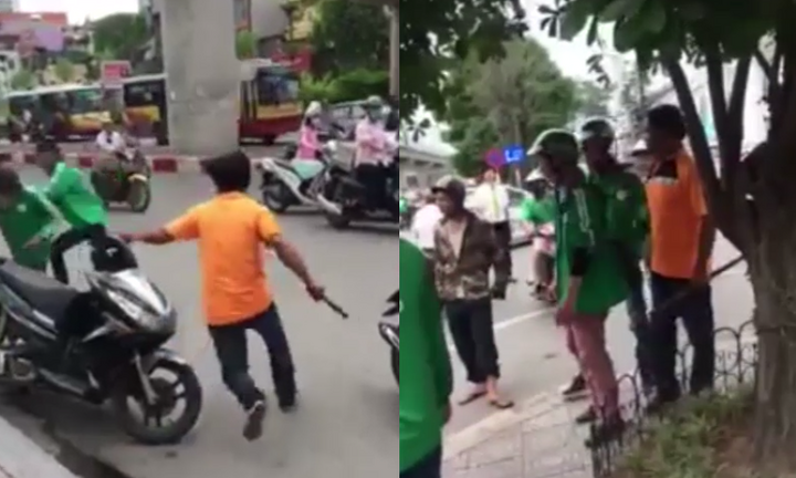 Tranh giành khách, lái xe ôm cầm gậy đuổi đánh tài xế Grabbike trên phố Hà Nội