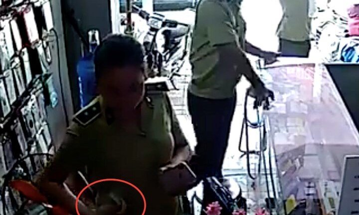 Quản lý thị trường Yên Bái xác minh 'nữ cán bộ nhận tiền của chủ hàng điện thoại'