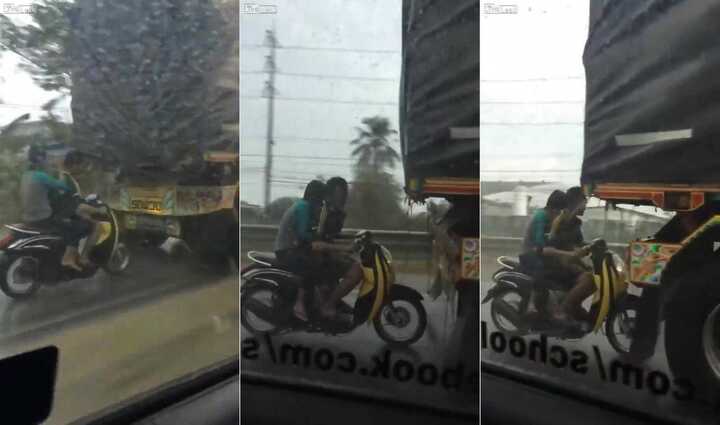 Thót tim cảnh xe máy trú mưa theo phong cách 'thách thức thần chết'