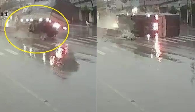 Phóng nhanh trên đường trơn, xe tải 'gặm' nát dải phân cách rồi lật nhào