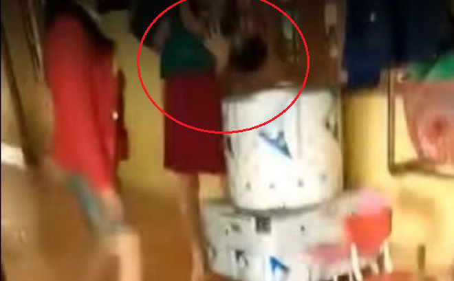 Hiệu trưởng dốc đầu bé trai vào máy vặt lông gà bị tạm đình chỉ công tác