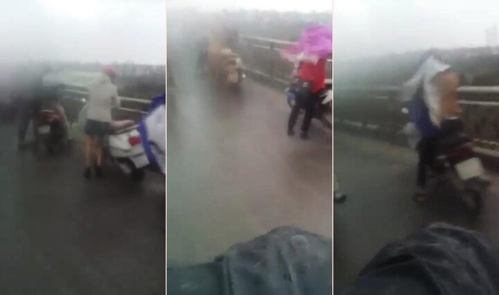 Clip: Hà Nội chìm trong dông lốc, xe máy 'vật lộn' với gió dữ
