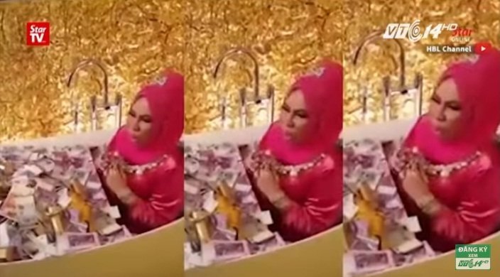 Nữ CEO nằm trong bồn tắm đầy tiền và trang sức gây tranh cãi