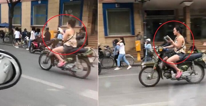 Clip: Không mũ bảo hiểm, cô gái vừa lái xe máy, vừa đọc sách trên phố Hà Nội