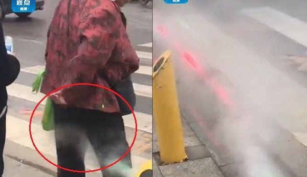 Clip: Đi bộ sai luật ở Trung Quốc, bị phạt... xịt ướt quần