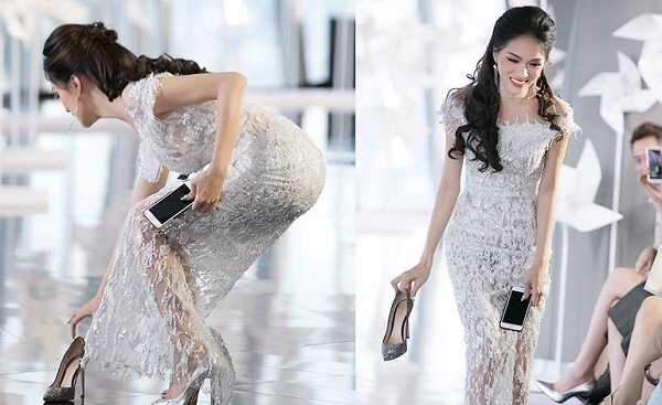 Hoa hậu Hương Giang nhặt giày cho Minh Tú trên sàn catwalk