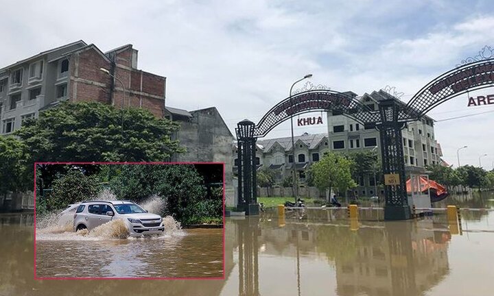 Ô tô rẽ sóng vượt qua làng biệt thự triệu đô giữa lòng Thủ đô