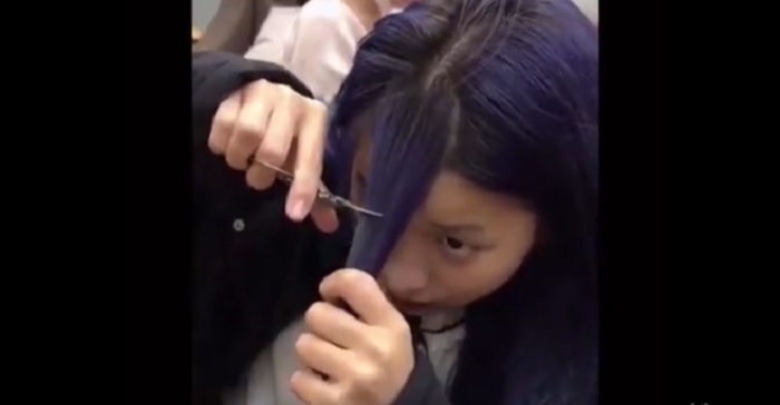 Thiếu nữ đau khổ sau màn tự cắt tóc