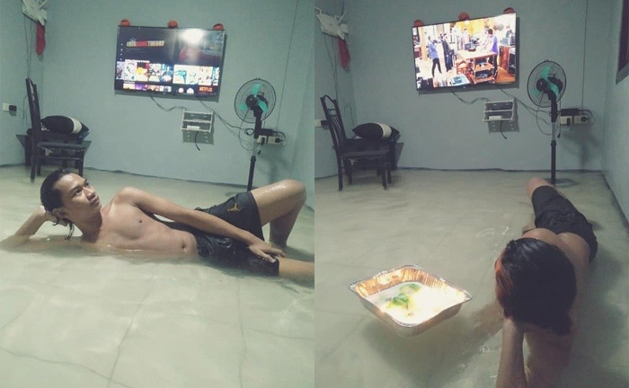 Nhà ngập lụt vẫn nằm khểnh xem tivi, người đàn ông bỗng dưng nổi tiếng