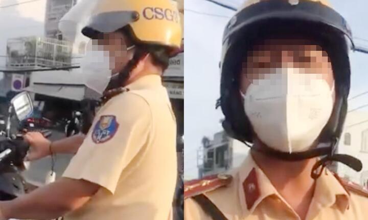 Tài xế ở TP.HCM bị hất rơi điện thoại 2 lần khi ghi hình CSGT