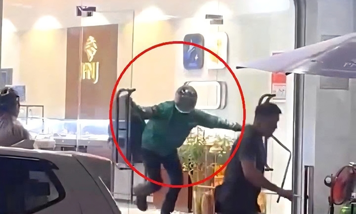 Nam thanh niên mặc áo Grab, cầm búa xông vào cướp tiệm vàng ở Đà Nẵng