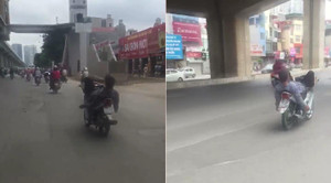 Khiếp đảm thanh niên nằm ngửa, lái xe máy bằng chân như làm xiếc trên phố