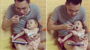 Bố mải xem phim, ăn sữa chua, quên béng con gái nhỏ khiến dân mạng phì cười