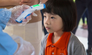 Học sinh Nhật Bản, Singapore vẫn đến trường giữa dịch virus corona