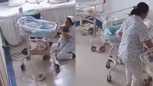 Y tá Trung Quốc gồng mình giữ trẻ sơ sinh trong động đất