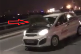 Cảnh sát truy tìm tài xế lái taxi lật nắp capo, đánh võng trên cầu Nhật Tân