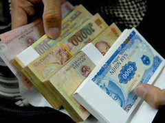 Tiền mới mệnh giá 10.000 đồng, đổi 2 ăn 1