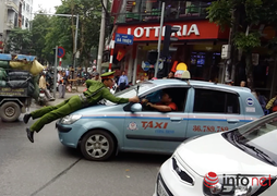 Cảnh sát bị tài xế kéo lê trên nắp capo dọc phố Bà Triệu