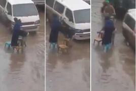 Clip chồng bắc ghế trong lũ cho vợ bước qua khỏi ướt chân gây bão mạng