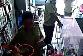 Quản lý thị trường Yên Bái xác minh 'nữ cán bộ nhận tiền của chủ hàng điện thoại'