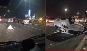 Xe Mazda lộn nhiều vòng rồi lật ngửa trên cầu Nhật Tân, nữ tài xế nguy kịch
