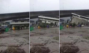 Gió khủng khiếp thổi bay cả tòa nhà trong bão Nida