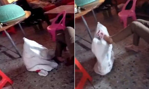 Phẫn nộ clip bé gái bị bà nhét vào bao tải, đánh đập dã man