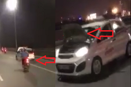 Taxi bị lật nắp capo phóng tốc độ cao, đánh võng trên cầu Nhật Tân