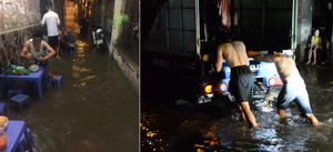 Mưa lớn kéo dài, người Hà Nội khốn khổ ăn tối giữa biển nước