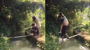 'Soái ca' ga lăng cõng bạn gái qua cầu và cái kết không thể nhịn cười