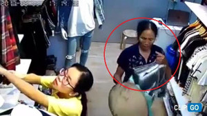 'Nữ quái' mang nón lá, bao tải đi trộm quần áo trong cửa hàng