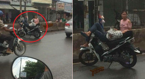 Thanh niên thản nhiên dựng xe máy, nằm ngủ 'quên đời' giữa quốc lộ