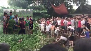 Công an bị dân ngăn cản, bế đi chỗ khác để thoải mái đánh đập tên trộm chó