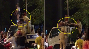 Xôn xao clip cô gái xinh đẹp trèo lên nóc xe CSGT la hét, nhảy múa