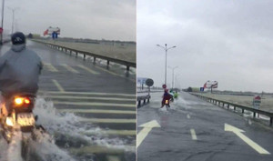 Clip: Nước chảy xiết tràn qua quốc lộ, dân Quảng Nam vẫn liều lĩnh chạy xe máy qua