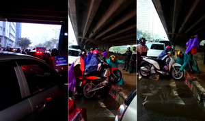 Clip: Đường vành đai 3 'tê liệt', dân đua nhau bê xe máy qua thảm cỏ để thoát tắc đường