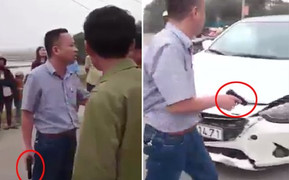 Tài xế ô tô rút súng dọa bắn người sau va chạm giao thông