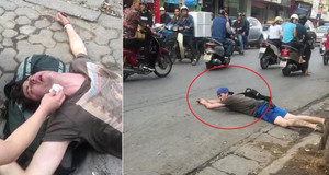 Xôn xao clip thanh niên Tây say thuốc lào, vạ vật 'bơi cạn' trên phố Hà Nội