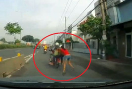 Clip: Hai tên cướp kéo lê cô gái trăm mét ở Bình Dương