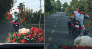 Clip: Thợ quay phim đám cưới ngồi ngược trên xe máy, hành nghề cực 'có tâm'