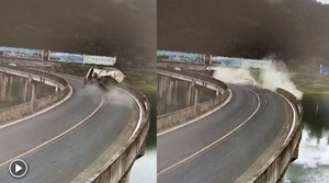 Video: Xe bồn chở xi măng nổ lốp lao xuống hồ